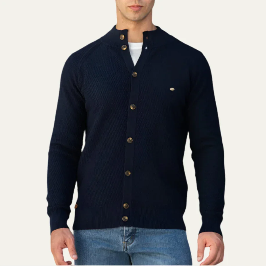 Man wearing a navy blue cardigan with buttons on a white background