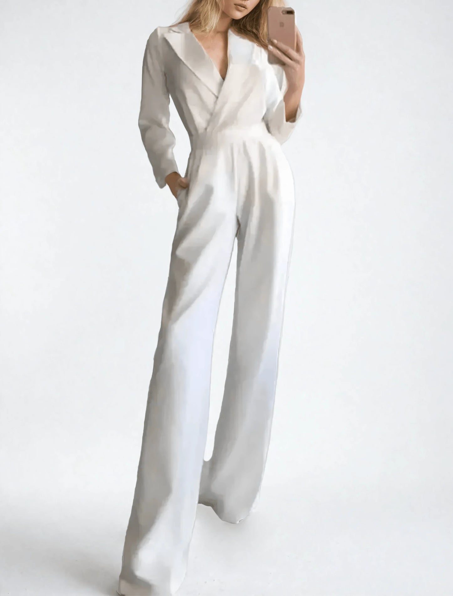 Woman wearing a white jumpsuit on a plain background