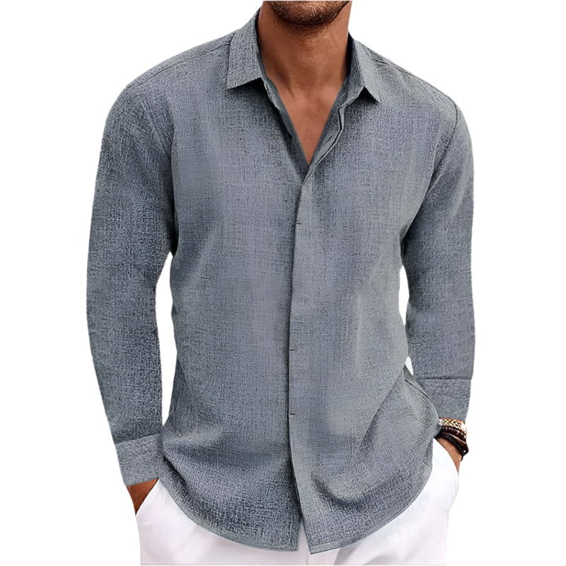 Gray button-up shirt worn by a person on a neutral background