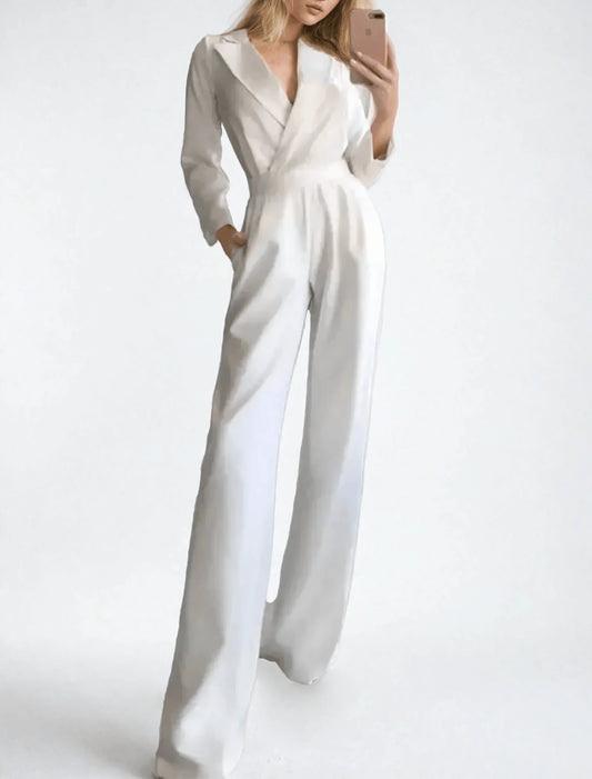 Woman wearing a white jumpsuit on a plain background