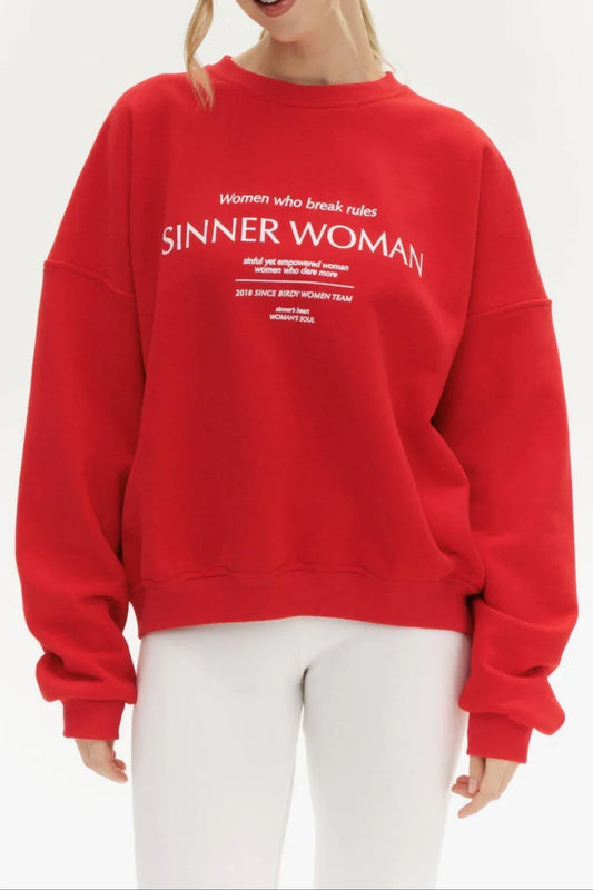 Woman wearing a red sweatshirt with text on a white background