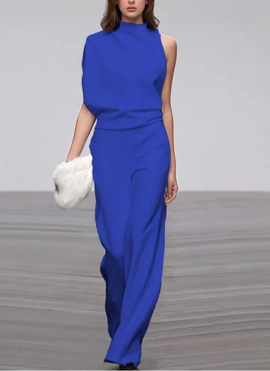 Woman wearing a blue outfit on a plain background