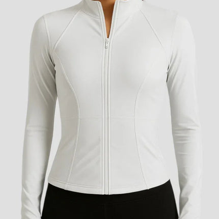 Woman wearing a white long-sleeve athletic jacket on a light gray background