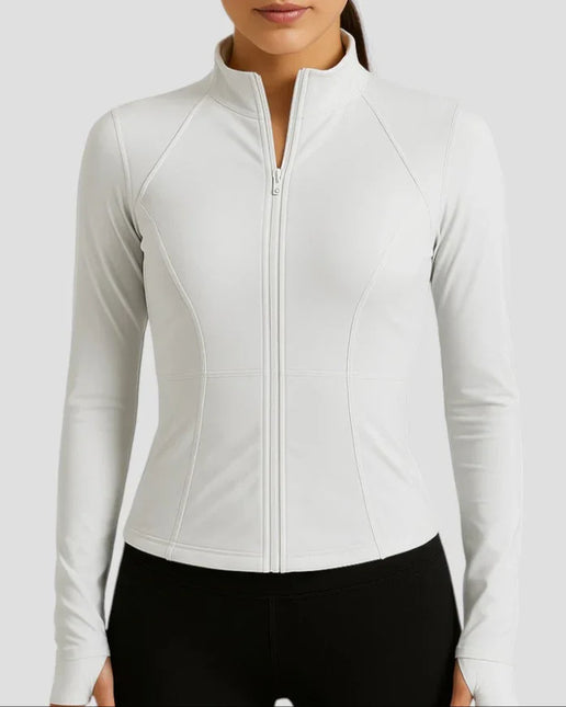 Woman wearing a white long-sleeve athletic jacket on a light gray background
